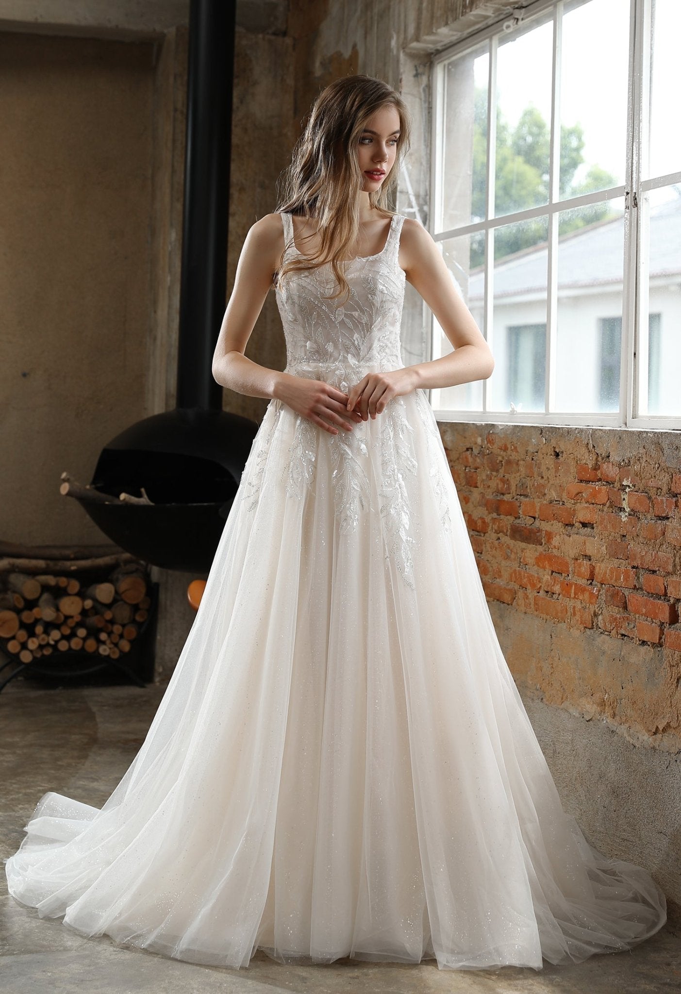 ESTER A leafy trailing design on a square neckline bodice. A - line skirt - Reflections Bridal Studio