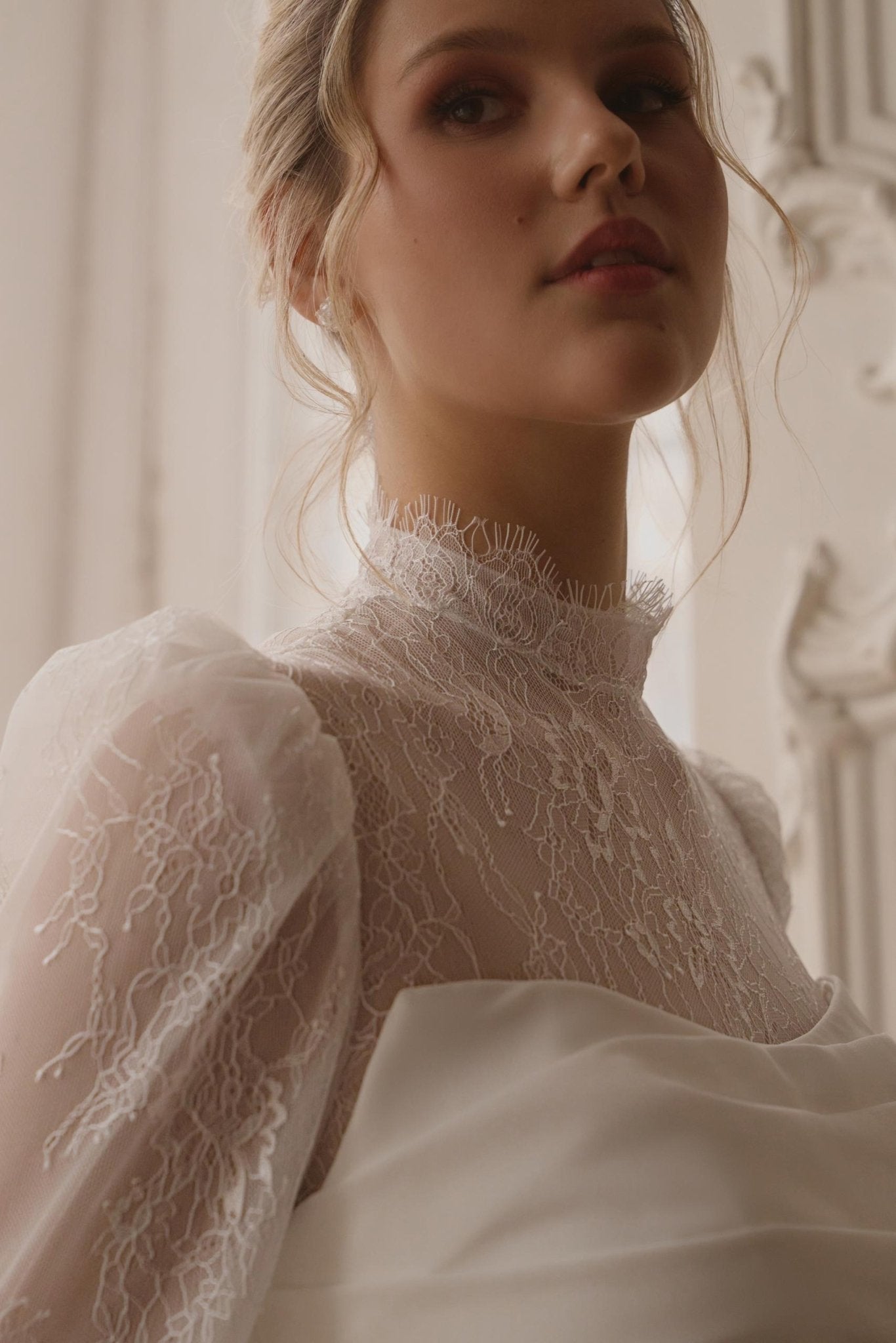 JULIANNA Lace high neckline and long sleeves on a crepe gown - Reflections Bridal Studio