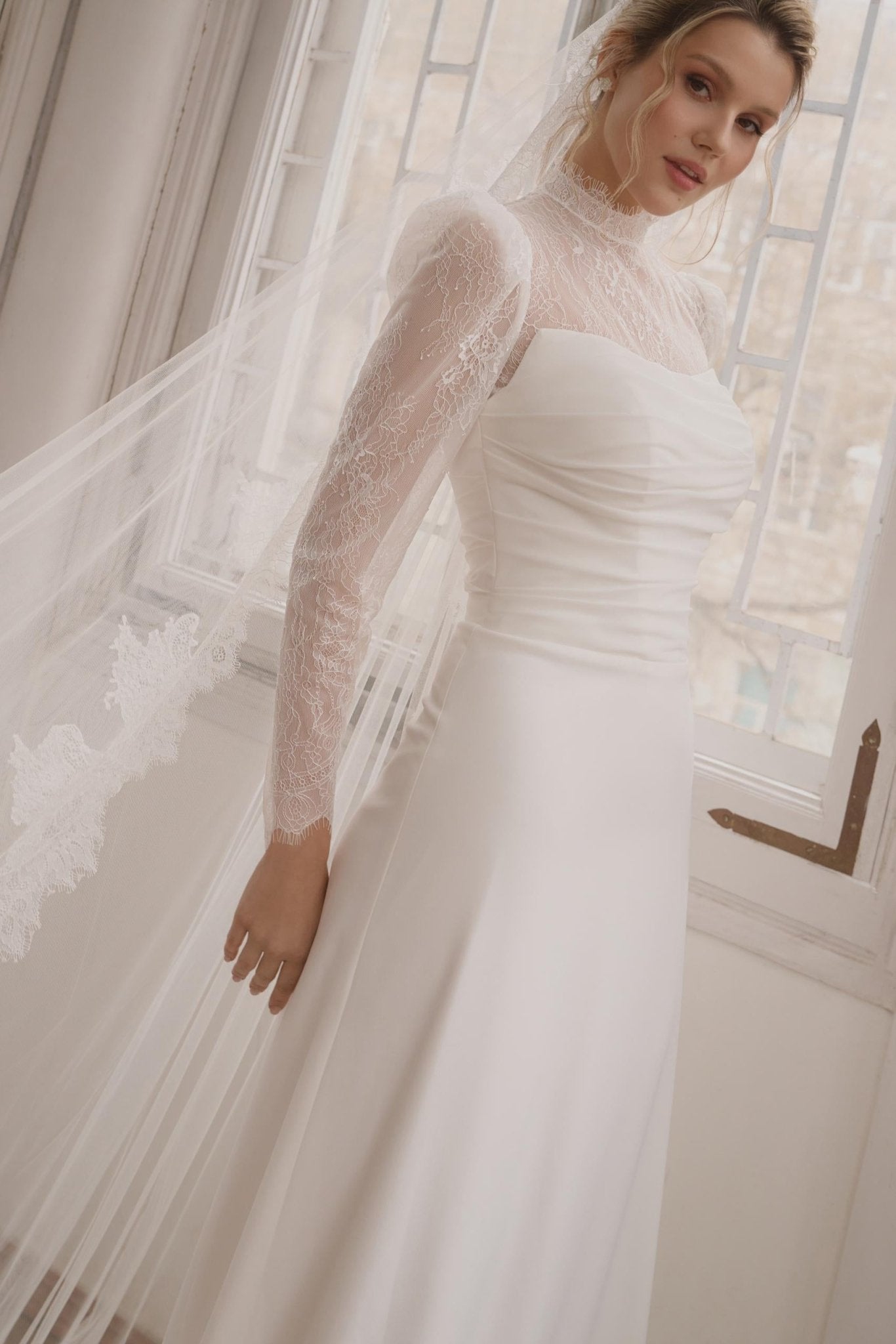 JULIANNA Lace high neckline and long sleeves on a crepe gown - Reflections Bridal Studio