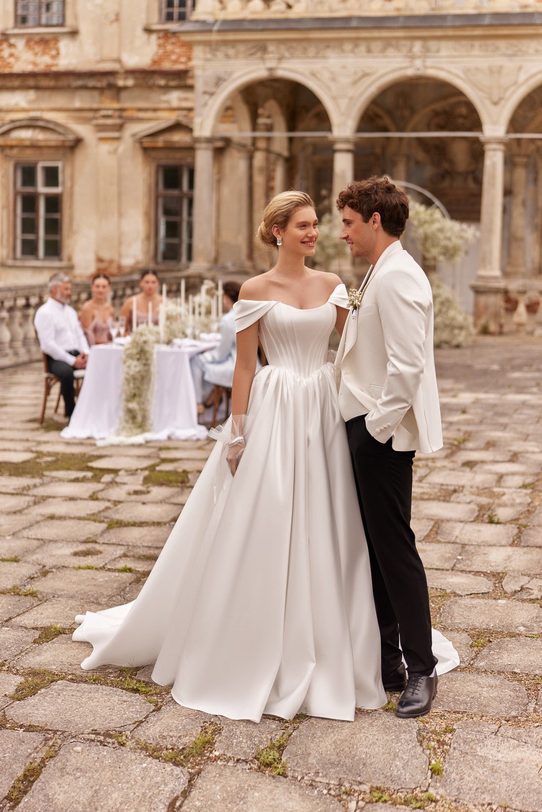LULU NV A matte satin ballgown with basque style bodice - Reflections Bridal Studio