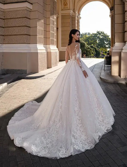 #BRYNN A stunning ballgown style with long beaded lace sleeves