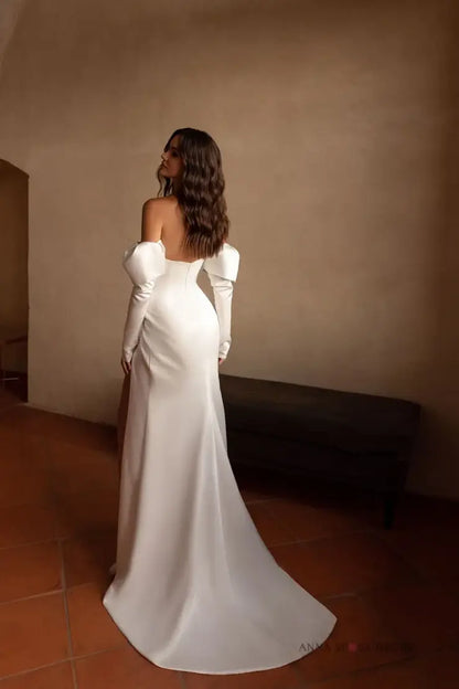 #CALLA A soft satin gown with a pleated bodice and front slit skirt