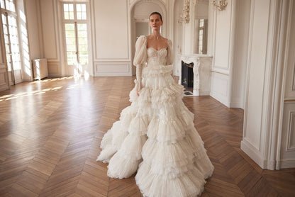 BASSEMA Indulgent layers of ruffles with glitter and lace. Detachable sleeves - Reflections Bridal Studio
