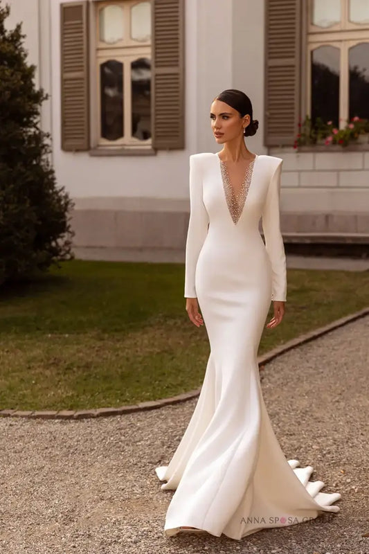 #DAYANA An elegant gown in crepe with beaded detail on front and back necklines