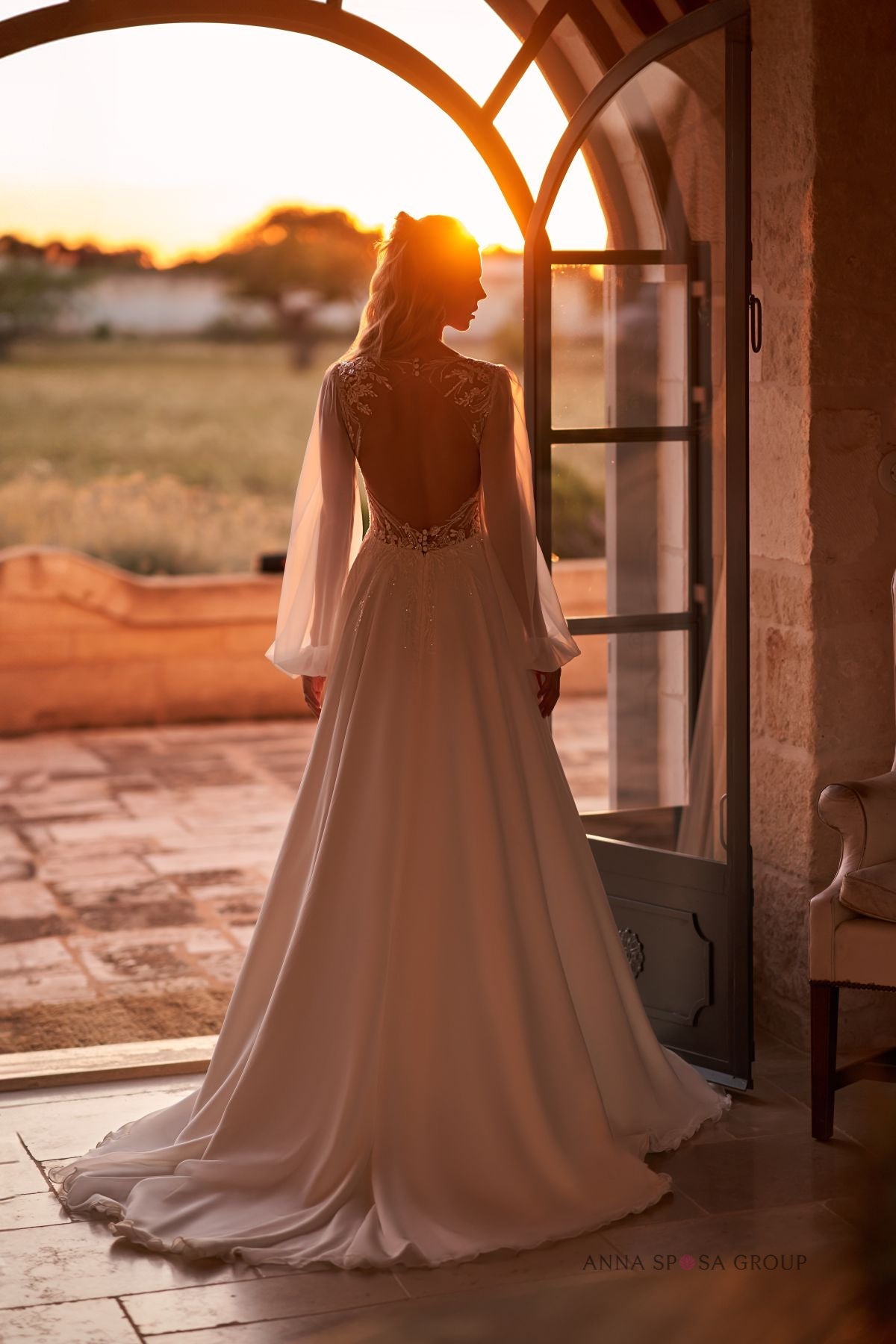 DEVNEY A romatic A - line gown with long sleeves - Reflections Bridal Studio