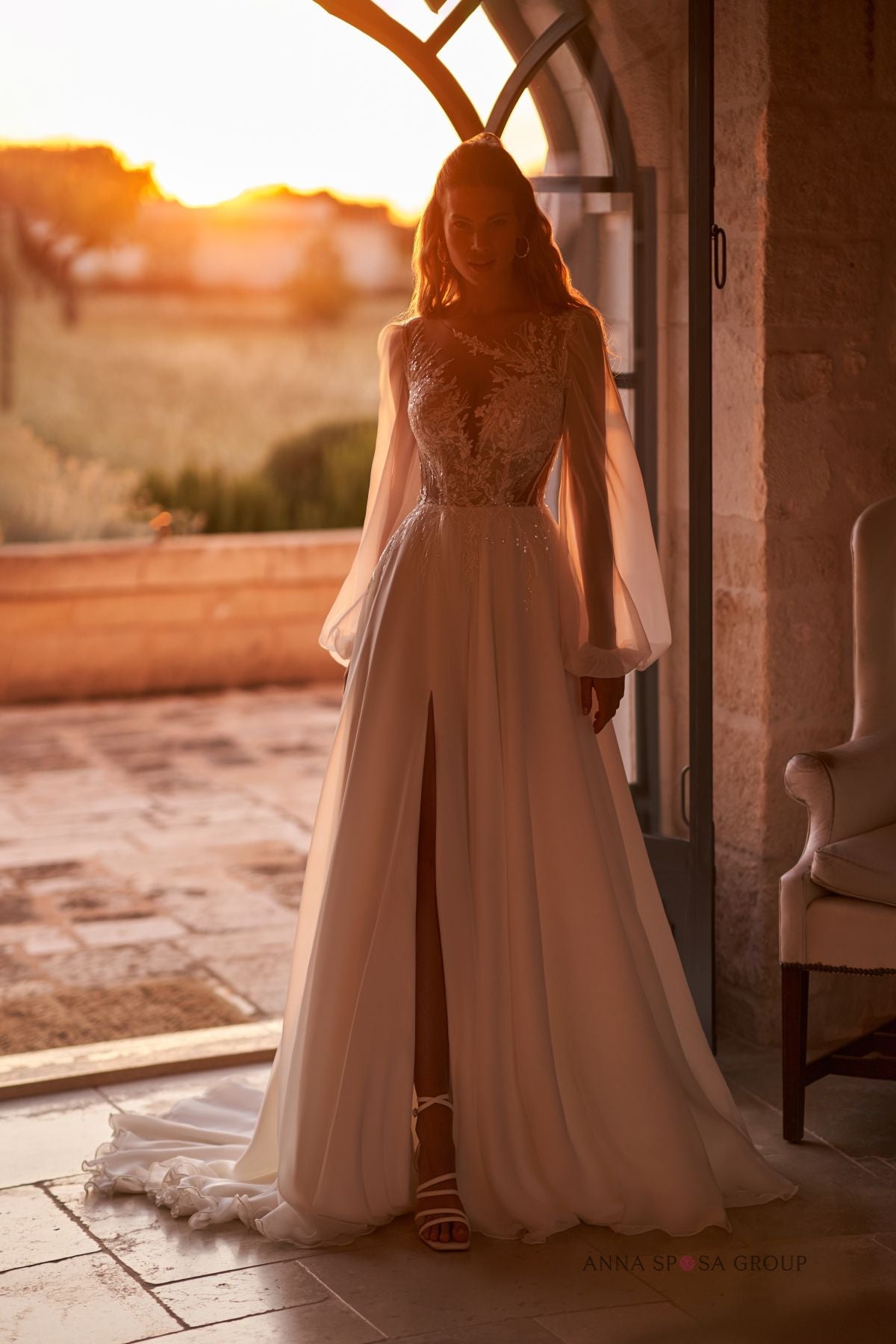 DEVNEY A romatic A - line gown with long sleeves - Reflections Bridal Studio
