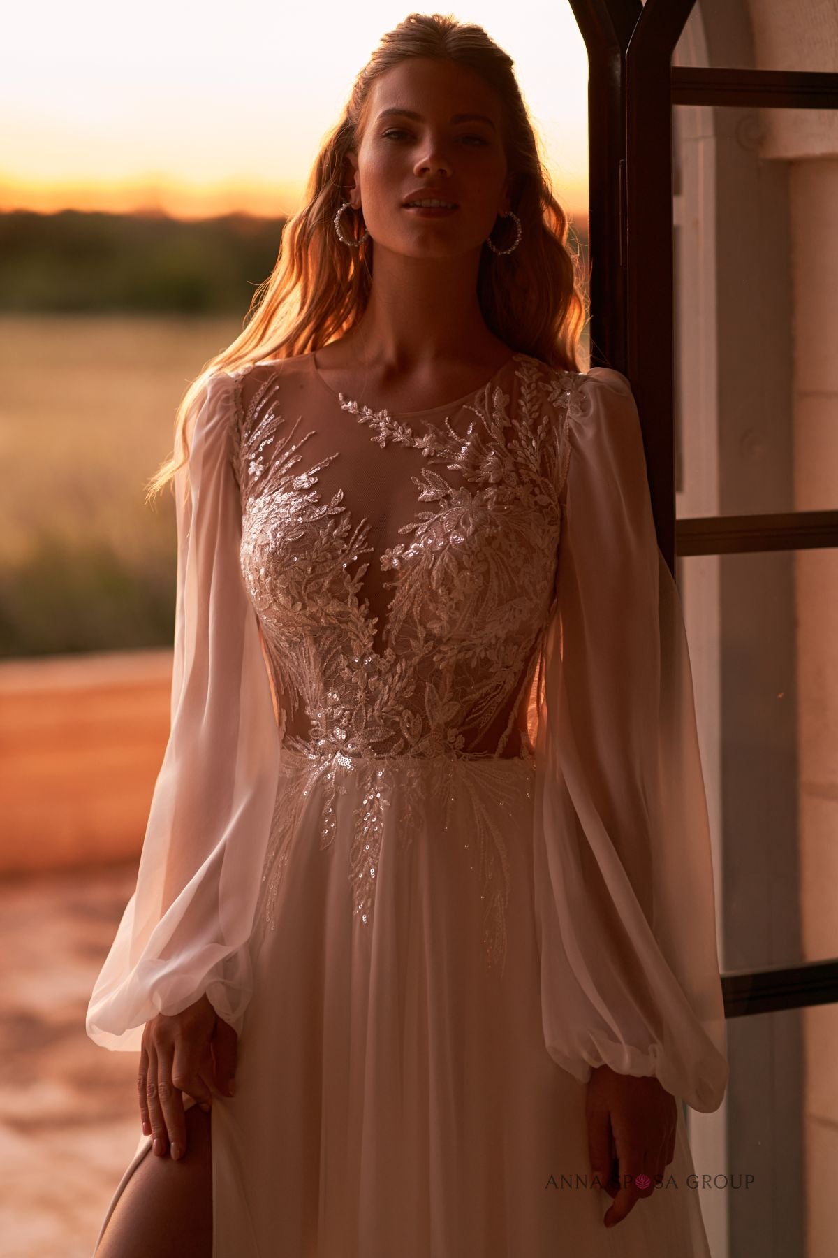 DEVNEY A romatic A - line gown with long sleeves - Reflections Bridal Studio
