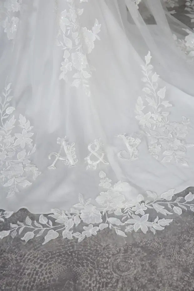 Livia skinny A - line lace over satin V - neckline. Lace illusion back - Reflections Bridal Studio