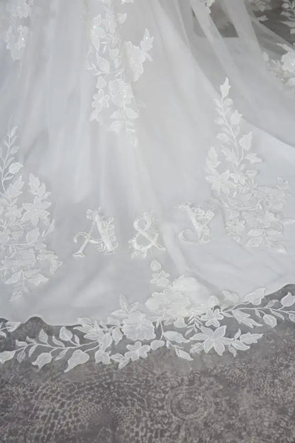 Livia skinny A - line lace over satin V - neckline. Lace illusion back - Reflections Bridal Studio