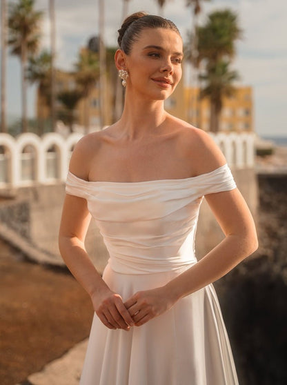 #MELODY Soft satin A-line gown with bardot neckline - Reflections Bridal Studio