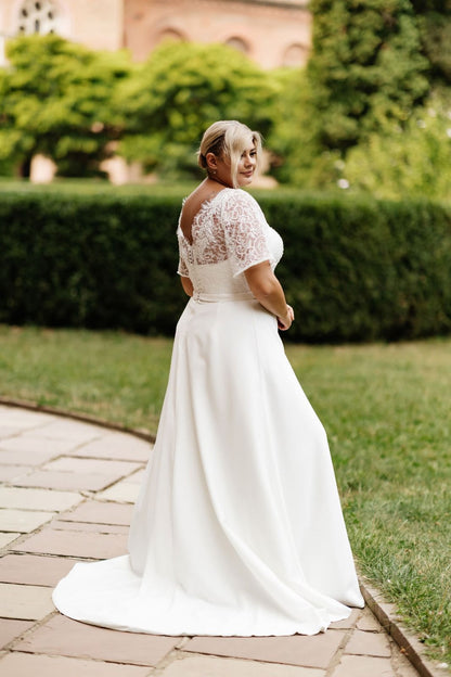 RABIA A modest satin and lace gown with flutter sleeves - Reflections Bridal Studio