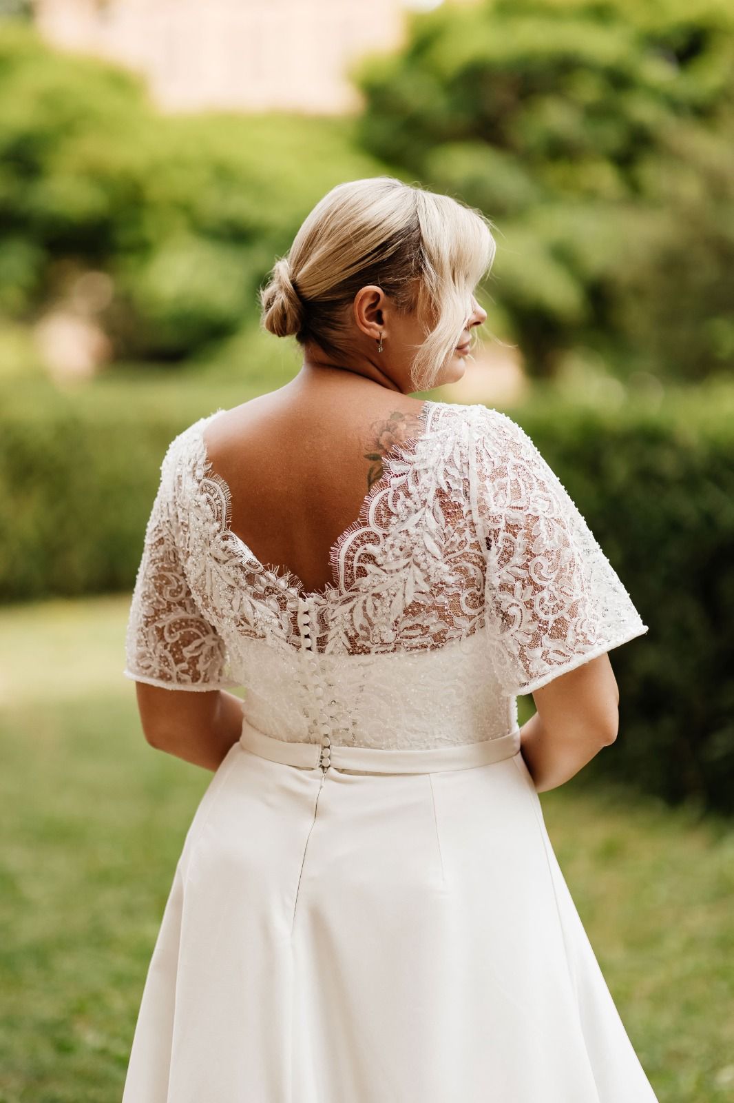 RABIA A modest satin and lace gown with flutter sleeves - Reflections Bridal Studio