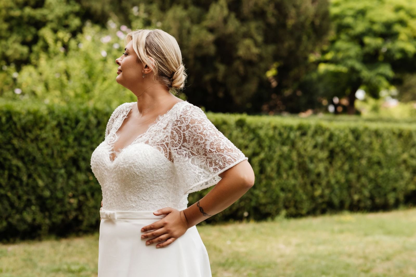 RABIA A modest satin and lace gown with flutter sleeves - Reflections Bridal Studio